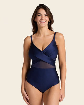 Bañador entero con escote cruzado y tela con brillo#color_509-azul-oscuro